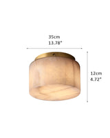 Round Alabaster flush mount ceiling light in brass frame for bedroom